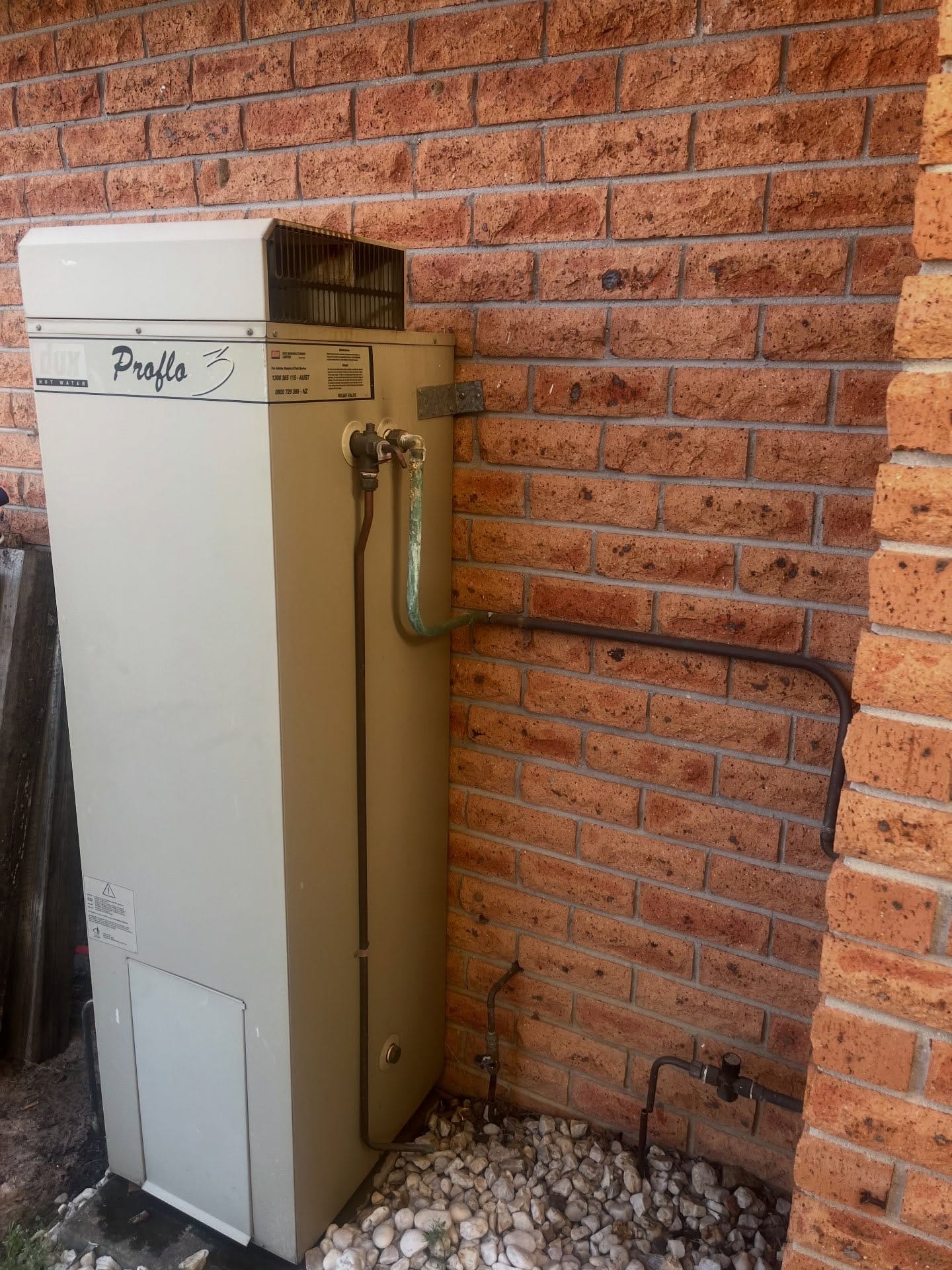 Existing gas storage hot-water unit before replacement